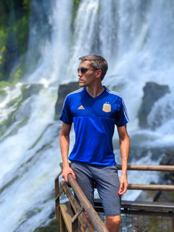 Nate Hake and the Iguazu Falls on his background